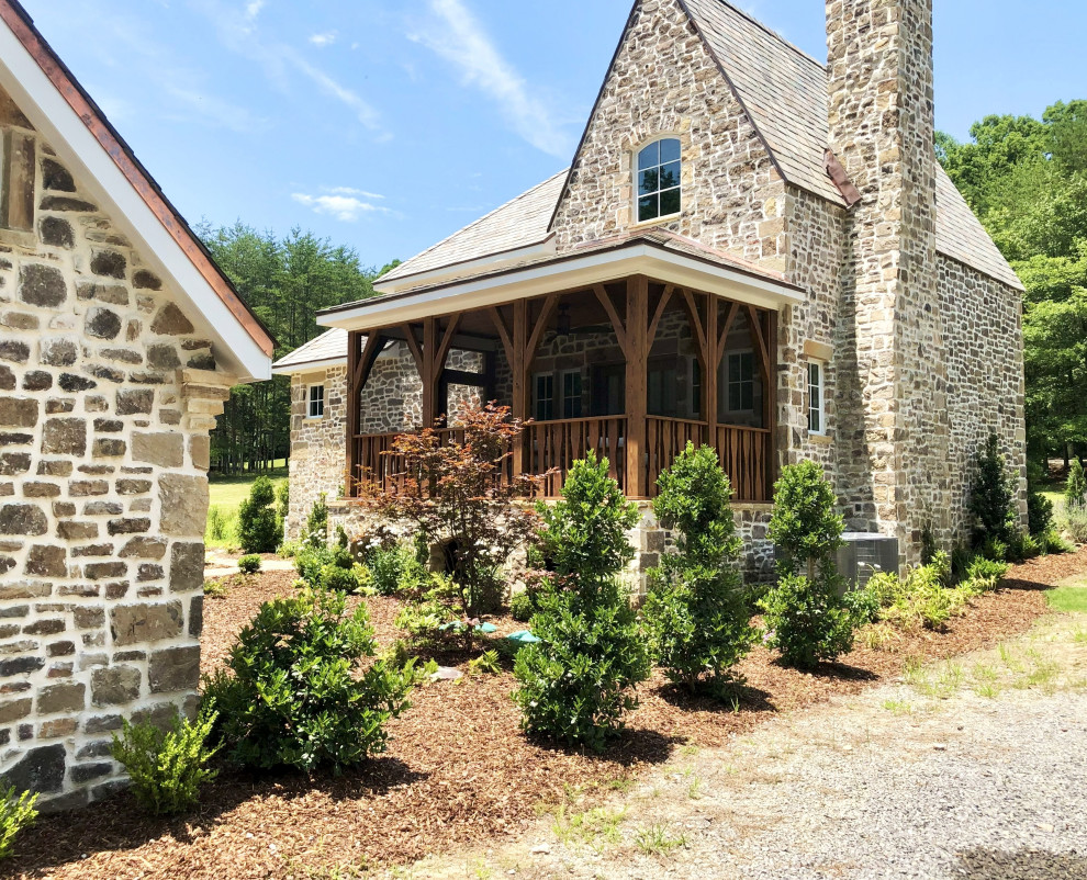 This is an example of a small traditional full sun side yard landscaping in Other.