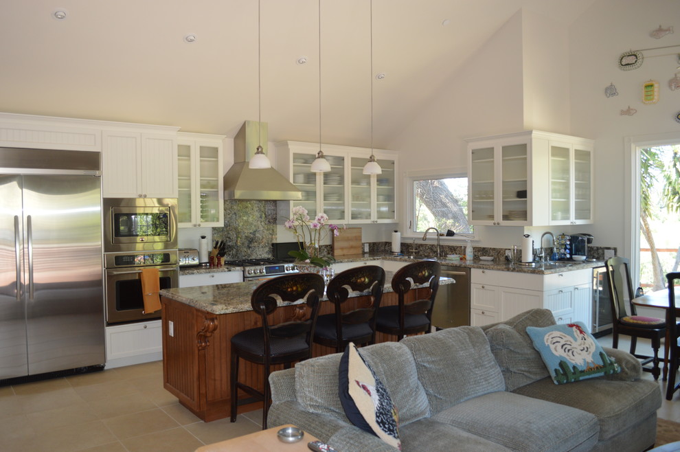 Mid-sized country l-shaped open concept kitchen photo in San Francisco with an undermount sink, glass-front cabinets, white cabinets, stainless steel appliances and an island