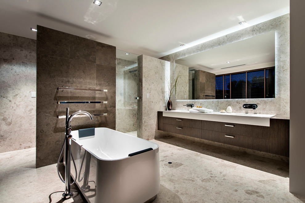 This is an example of a contemporary master bathroom in Perth with flat-panel cabinets, dark wood cabinets, a freestanding tub, a curbless shower, brown tile, beige walls, an integrated sink, porcelain tile, porcelain floors, engineered quartz benchtops, beige floor and an open shower.