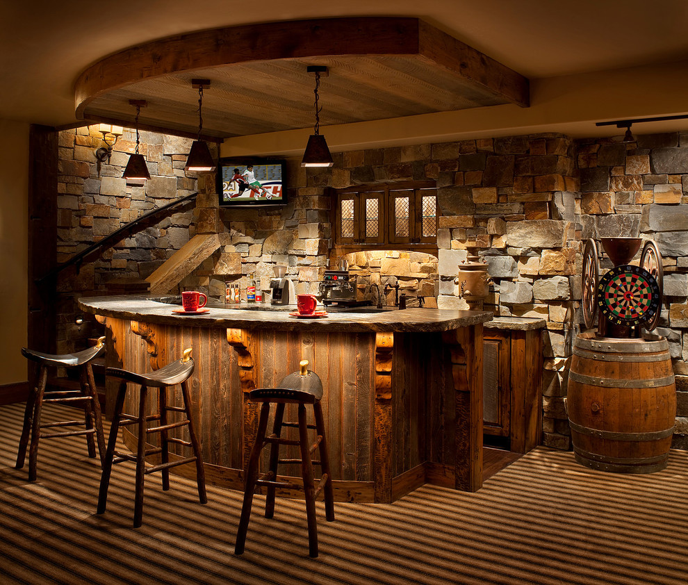 Country seated home bar in Other with medium wood cabinets and multi-coloured floor.