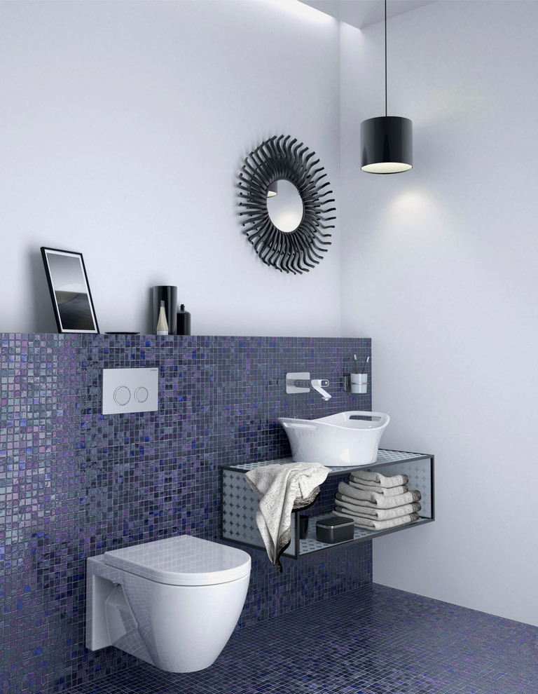 This is an example of a small contemporary 3/4 bathroom in Chicago with a vessel sink, tile benchtops, a wall-mount toilet, multi-coloured tile, white walls and mosaic tile floors.