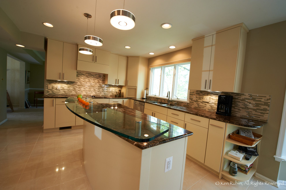 This is an example of a mid-sized contemporary l-shaped eat-in kitchen in DC Metro with a double-bowl sink, flat-panel cabinets, white cabinets, granite benchtops, multi-coloured splashback, matchstick tile splashback, stainless steel appliances, marble floors and with island.