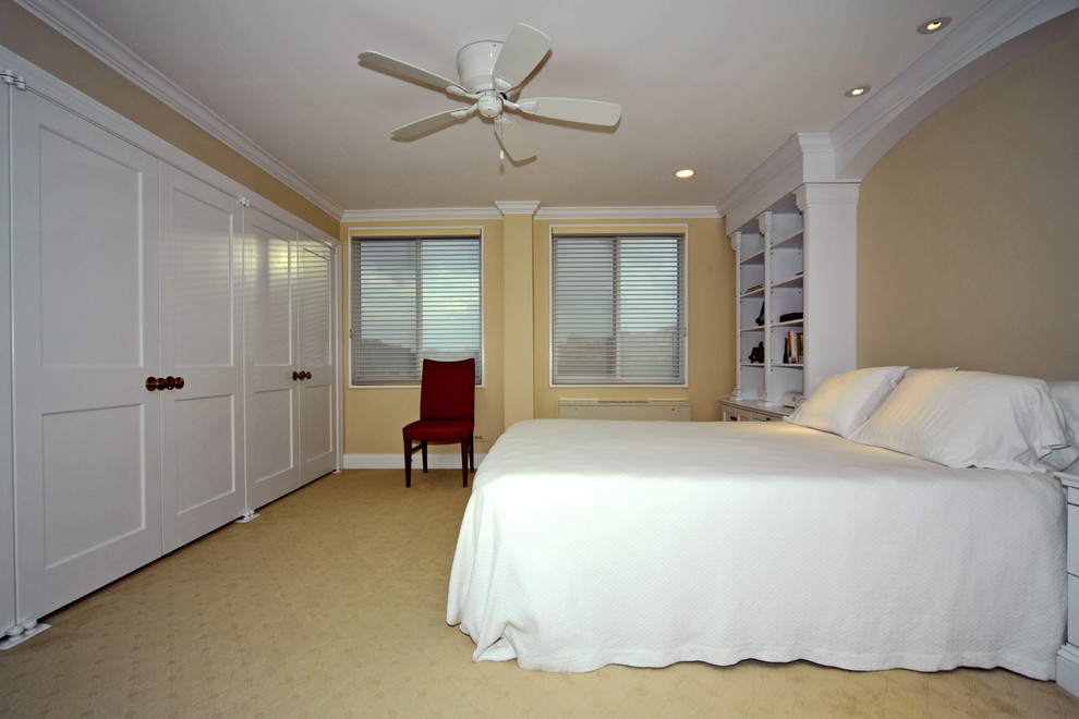 Design ideas for a large traditional master bedroom in DC Metro with beige walls, carpet, no fireplace and yellow floor.
