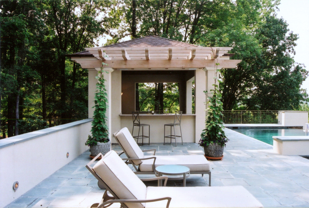 Design ideas for an arts and crafts backyard pool in Other with a pool house.