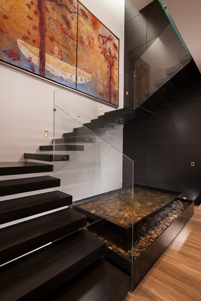 Inspiration for a contemporary floating staircase in Other with open risers.