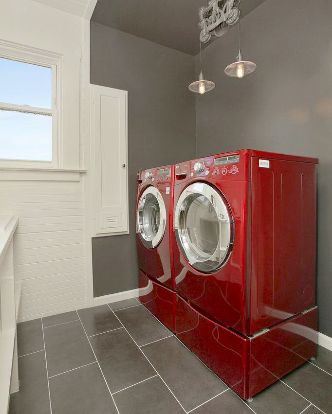 Design ideas for a small contemporary galley dedicated laundry room in San Francisco with an utility sink, open cabinets, white cabinets, wood benchtops, grey walls, ceramic floors and a side-by-side washer and dryer.