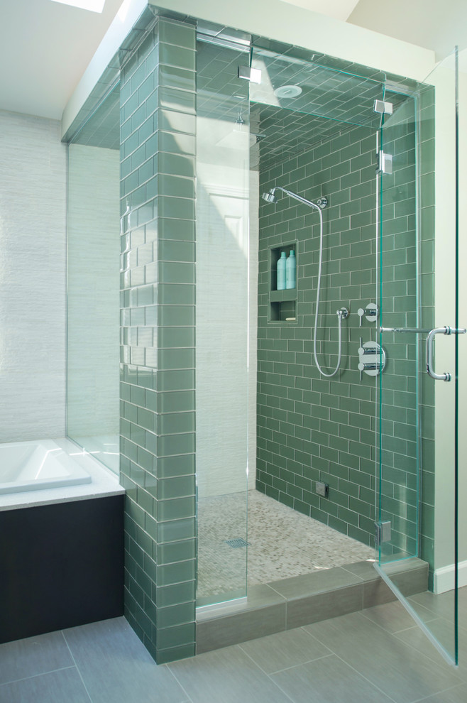 Photo of a mid-sized contemporary bathroom in Kansas City with an undermount sink, flat-panel cabinets, dark wood cabinets, engineered quartz benchtops, a drop-in tub, green tile, glass tile, green walls, porcelain floors and an alcove shower.