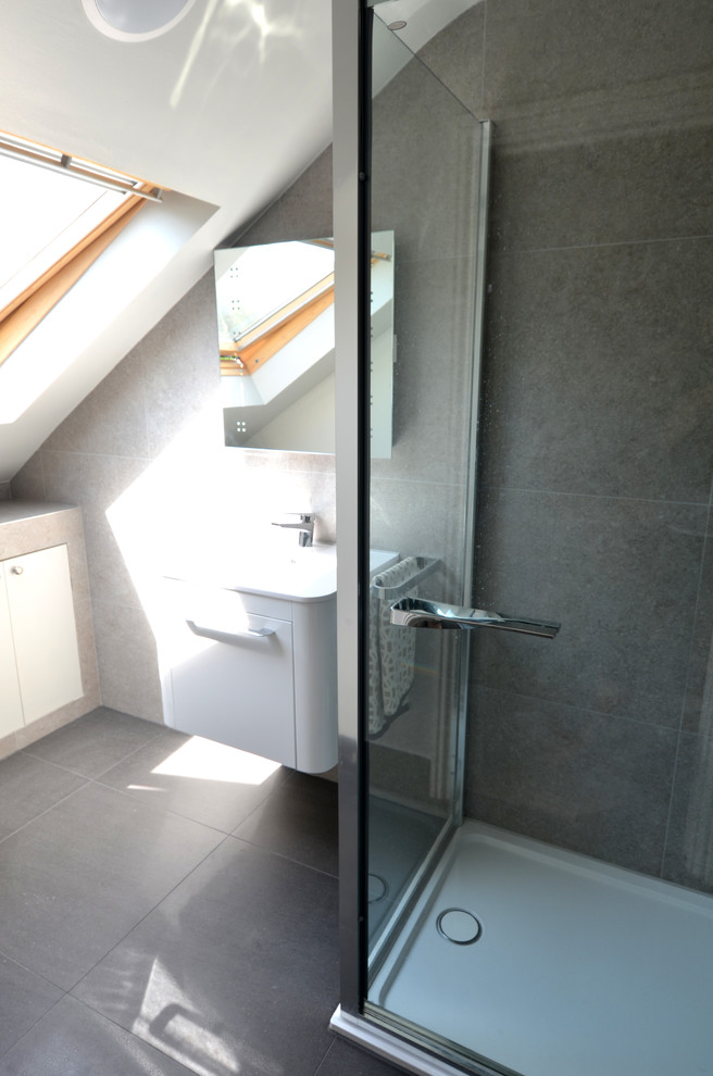 Contemporary bathroom in London with gray tile.