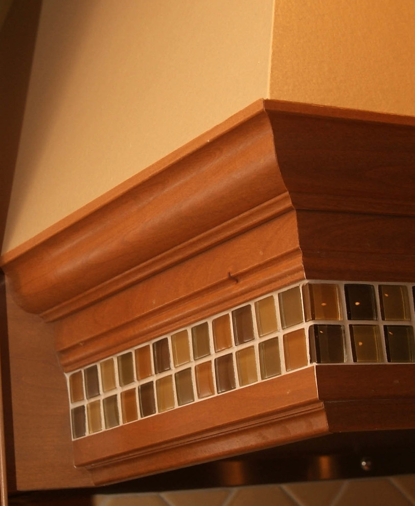 Example of a large transitional u-shaped light wood floor home design design in Chicago with an undermount sink, raised-panel cabinets, medium tone wood cabinets, granite countertops, beige backsplash, ceramic backsplash and stainless steel appliances