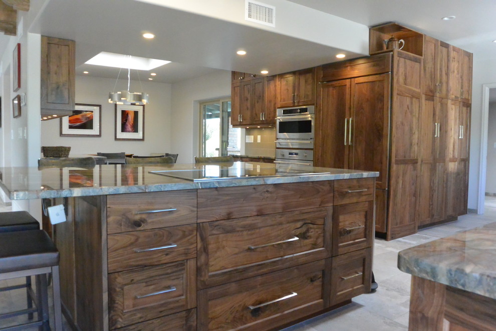 Inspiration for a huge transitional l-shaped porcelain tile and gray floor open concept kitchen remodel with an undermount sink, shaker cabinets, medium tone wood cabinets, quartzite countertops, white backsplash, porcelain backsplash, paneled appliances, an island and green countertops