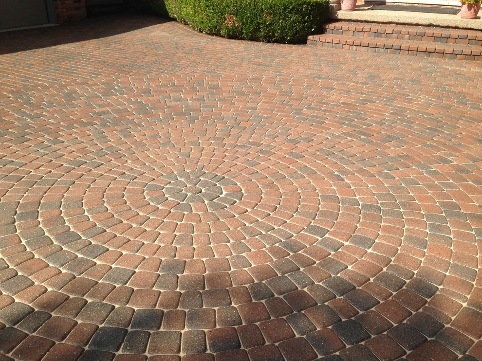 This is an example of a large front yard driveway in Detroit with brick pavers.
