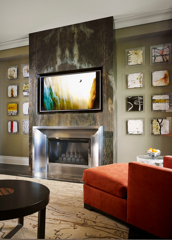 Inspiration for a large contemporary open concept living room in Chicago with a standard fireplace, a metal fireplace surround, a built-in media wall, green walls and dark hardwood floors.