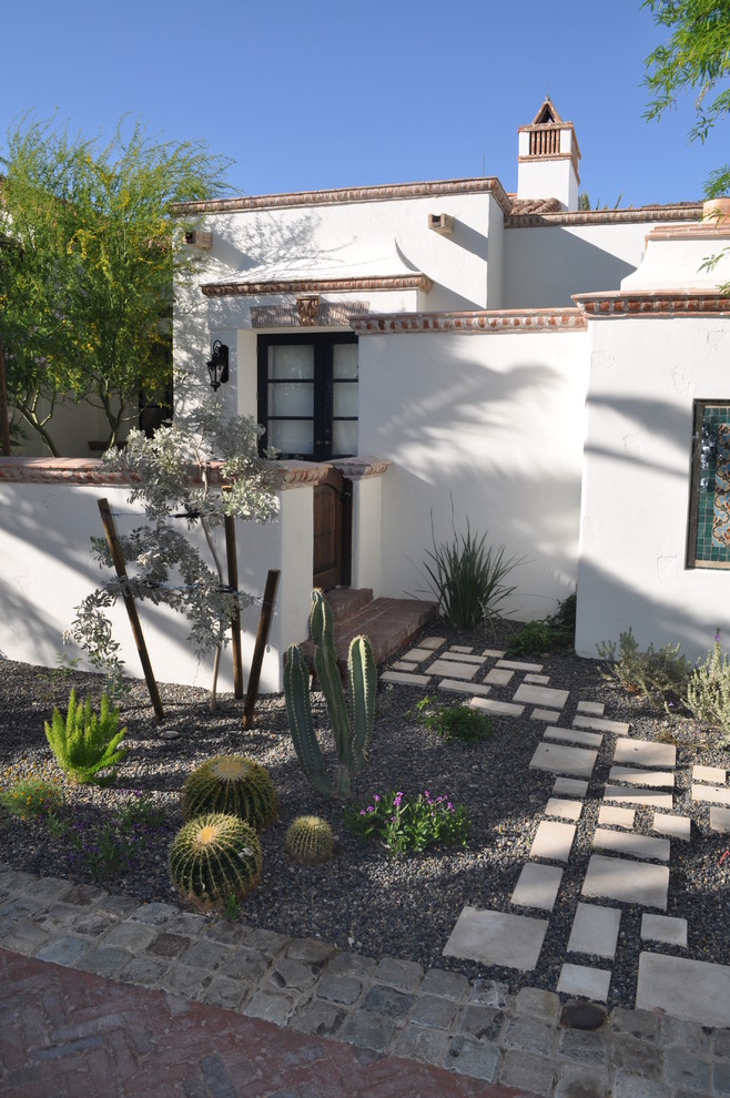 Inspiration for a mediterranean stucco exterior in Phoenix.