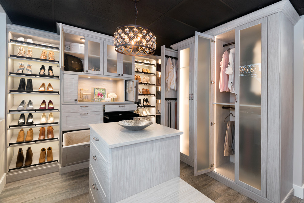 Large contemporary women's walk-in wardrobe in Other with shaker cabinets, white cabinets, porcelain floors and brown floor.