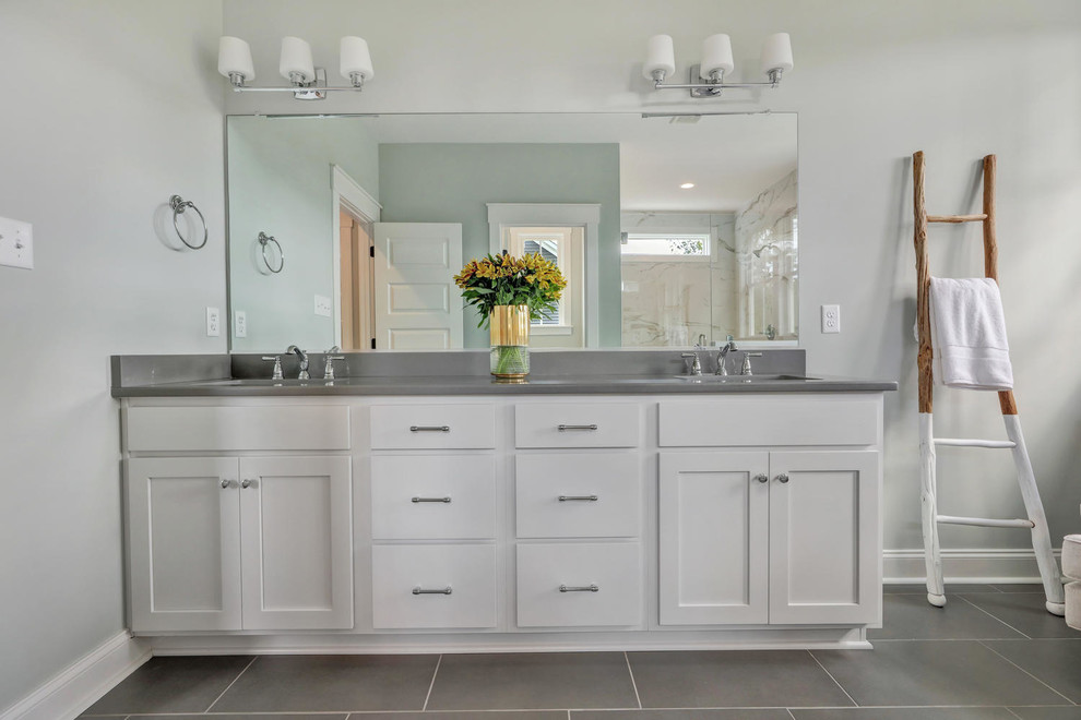 This is an example of a country bathroom in Richmond with shaker cabinets, white cabinets, a double shower, a two-piece toilet, porcelain tile, grey walls, porcelain floors, an undermount sink, engineered quartz benchtops, grey floor, a hinged shower door and grey benchtops.