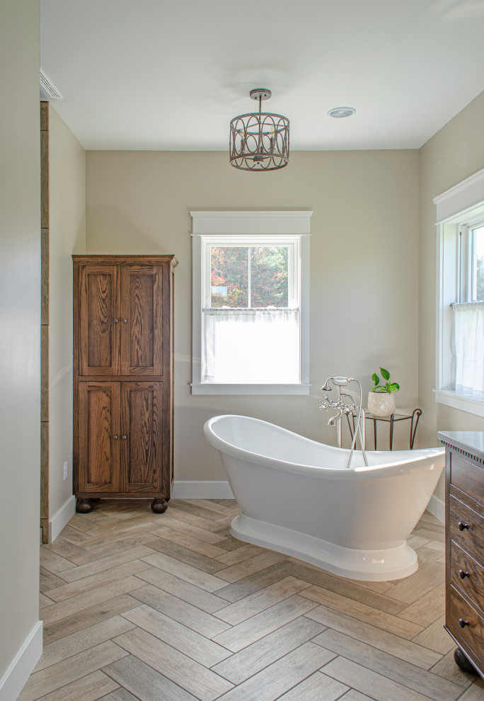This is an example of a mid-sized country master bathroom in Columbus with shaker cabinets, dark wood cabinets, a freestanding tub, an open shower, brown tile, wood-look tile, beige walls, wood-look tile, an undermount sink, engineered quartz benchtops, brown floor, an open shower, grey benchtops, a double vanity and a built-in vanity.