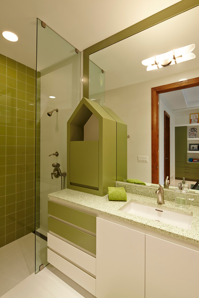 Large contemporary kids bathroom in Miami with an undermount sink, flat-panel cabinets, green cabinets, terrazzo benchtops, a curbless shower, a one-piece toilet, green tile, porcelain tile, white walls and porcelain floors.