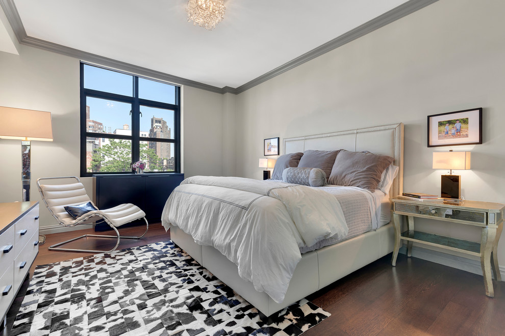 Design ideas for a mid-sized transitional master bedroom in New York with beige walls, dark hardwood floors, no fireplace and brown floor.