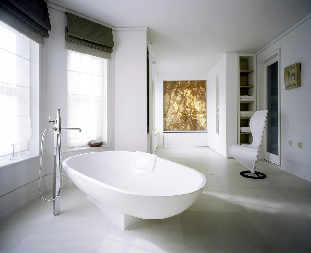 Design ideas for a contemporary bathroom in London with a freestanding tub and white walls.