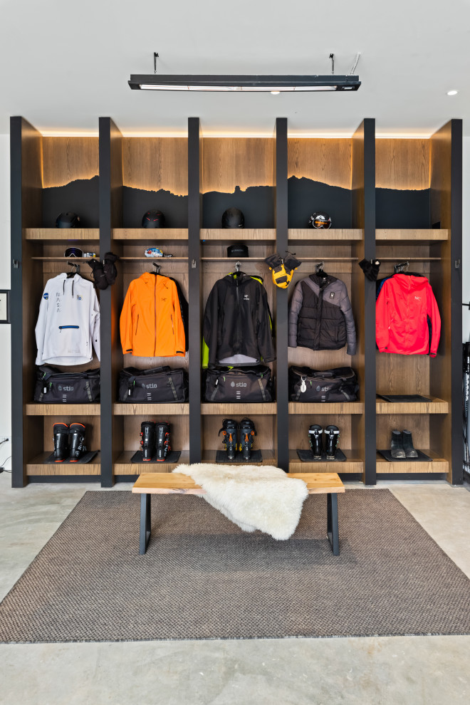 Large trendy attached two-car garage workshop photo