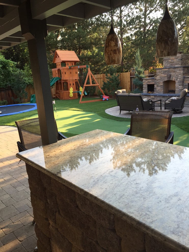 This is an example of a large contemporary backyard partial sun outdoor sport court for summer in Other with with outdoor playset and brick pavers.