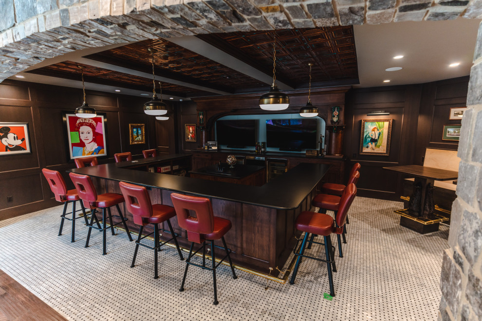 Inspiration for an expansive arts and crafts u-shaped seated home bar in Other with an undermount sink, shaker cabinets, medium wood cabinets, quartz benchtops, porcelain floors, white floor and black benchtop.