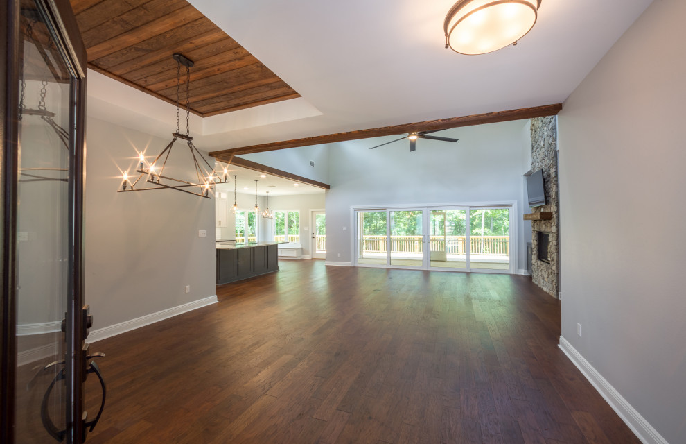 Foyer - mid-sized traditional medium tone wood floor and brown floor foyer idea with beige walls and a glass front door