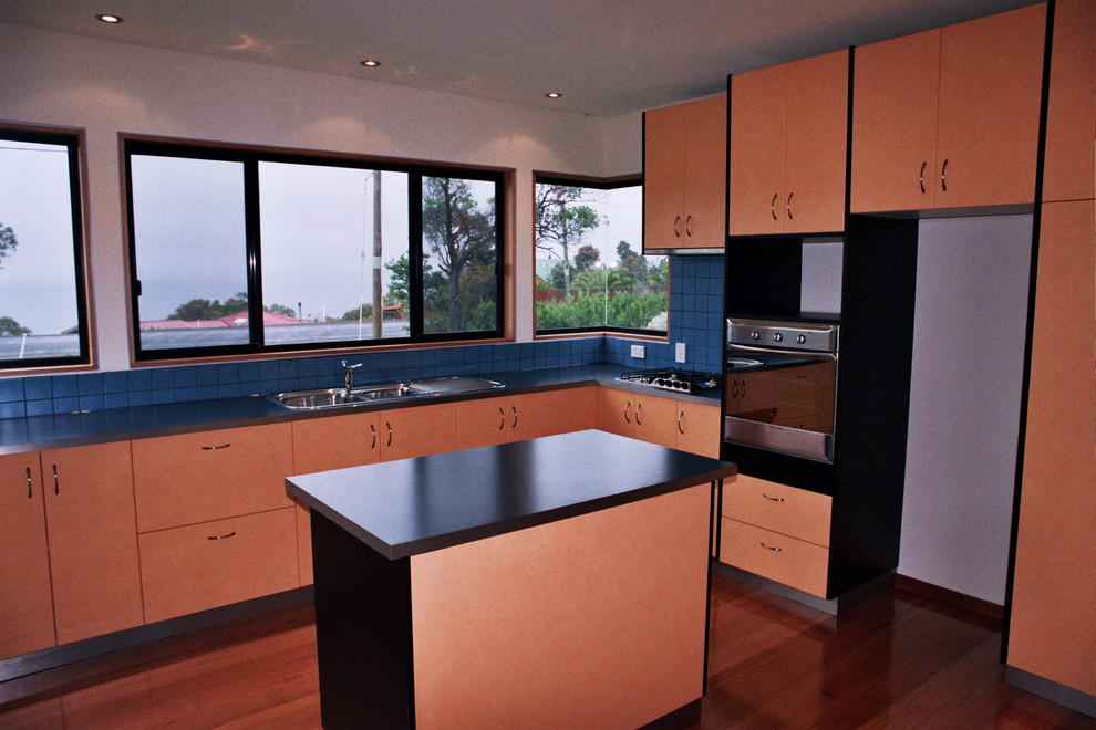 This is an example of a beach style kitchen in Hobart.