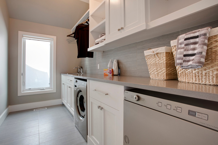 Transitional laundry room in Calgary.
