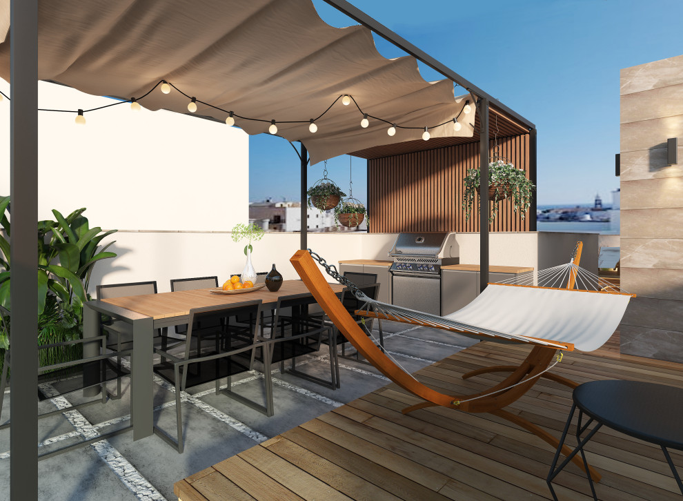 Réalisation d'une terrasse sur le toit minimaliste avec une cuisine d'été, une pergola et un garde-corps en matériaux mixtes.
