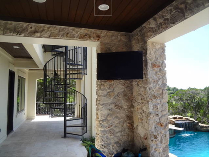 Patio - large transitional backyard stone patio idea in Orange County with a roof extension