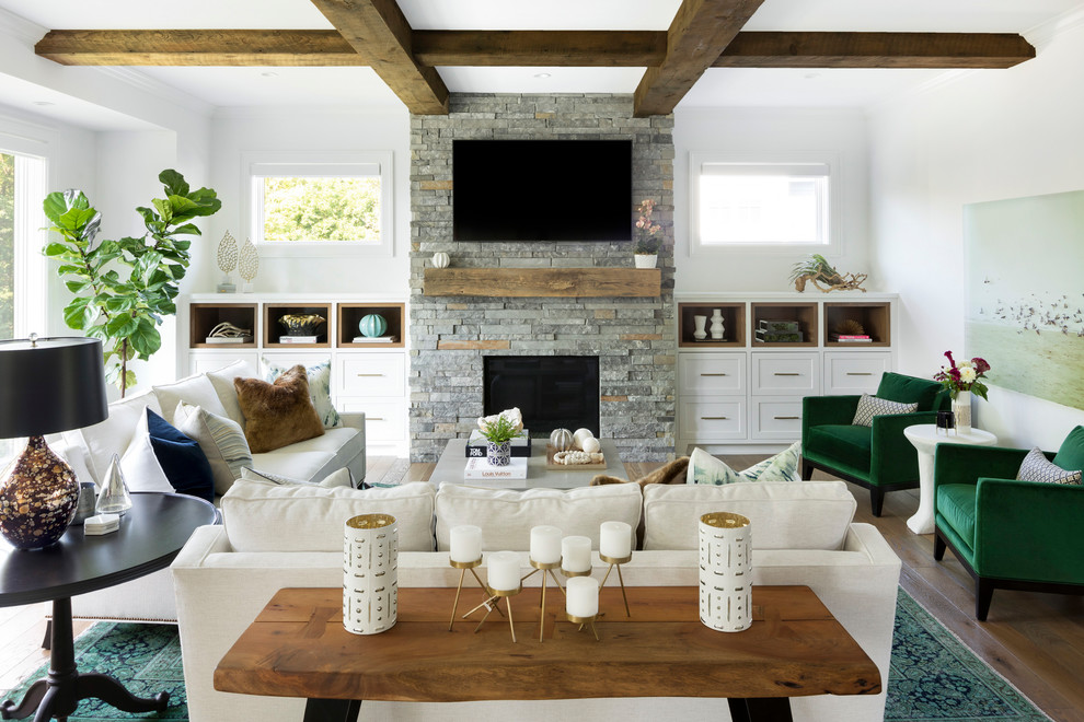 Photo of a mid-sized beach style living room in Minneapolis with white walls, a standard fireplace, a stone fireplace surround and a wall-mounted tv.