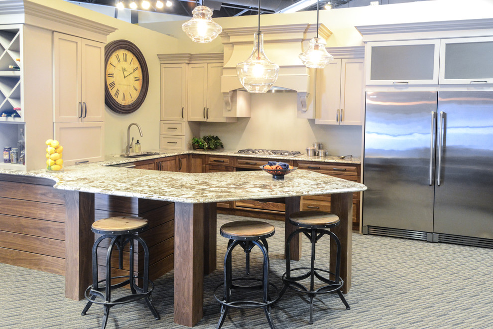 Eat-in kitchen - large transitional l-shaped concrete floor eat-in kitchen idea with an undermount sink, recessed-panel cabinets, blue cabinets, solid surface countertops, gray backsplash, porcelain backsplash, stainless steel appliances and an island
