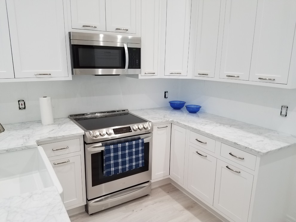 Example of a transitional kitchen design in Miami