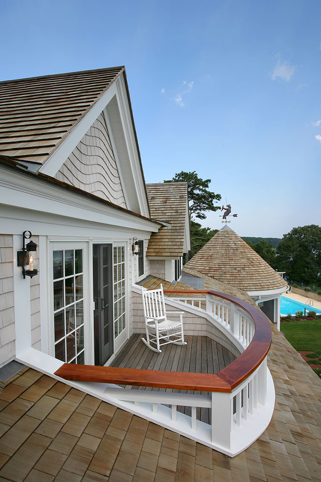 Photo of a mid-sized beach style side yard deck in Boston with no cover.