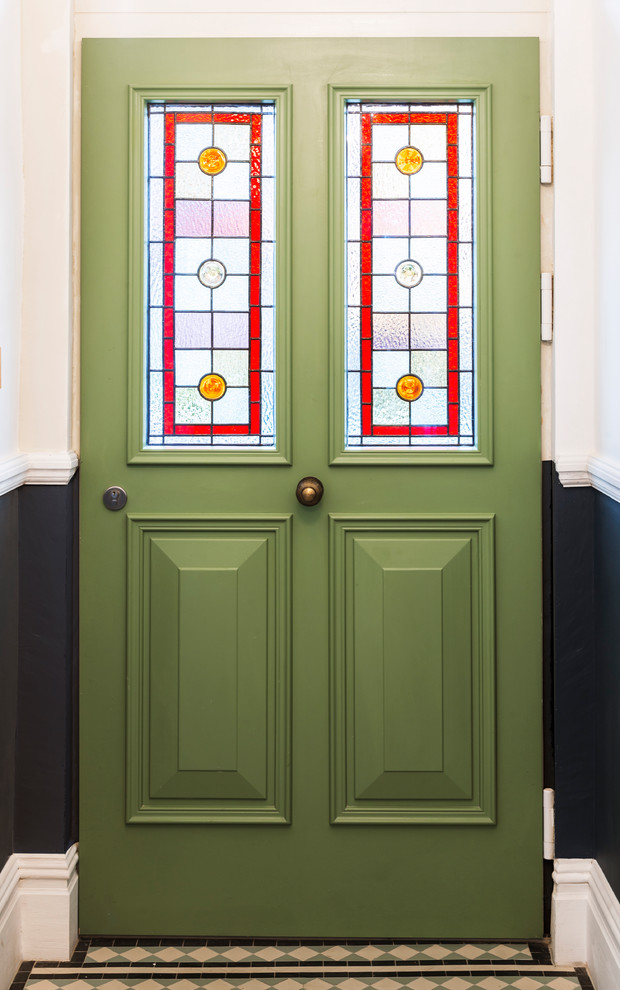 Inspiration for a traditional front door in Manchester with multi-coloured walls, ceramic floors, a single front door, a green front door and multi-coloured floor.