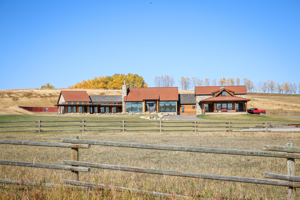Mountain style home design photo in Calgary