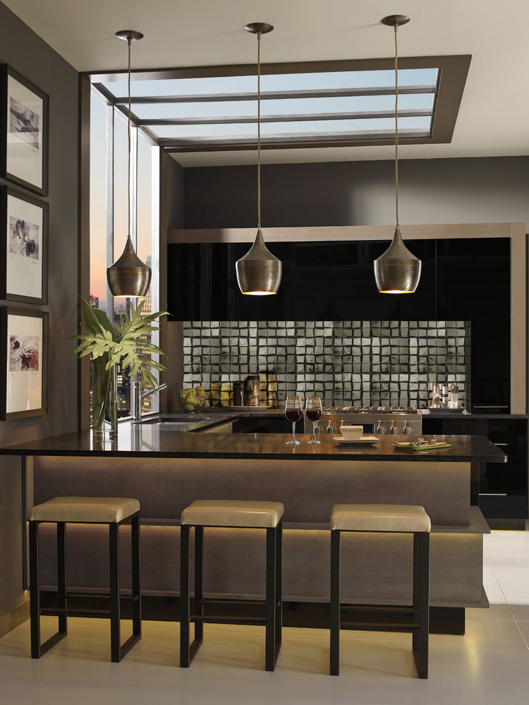 Mid-sized contemporary u-shaped eat-in kitchen in New York with an undermount sink, glass-front cabinets, dark wood cabinets, quartz benchtops, metallic splashback, glass tile splashback, stainless steel appliances, cement tiles, a peninsula and black benchtop.