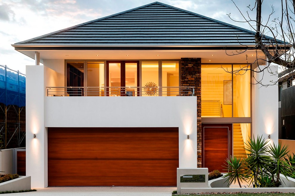 Design ideas for a mid-sized contemporary two-storey exterior in Perth with a hip roof.