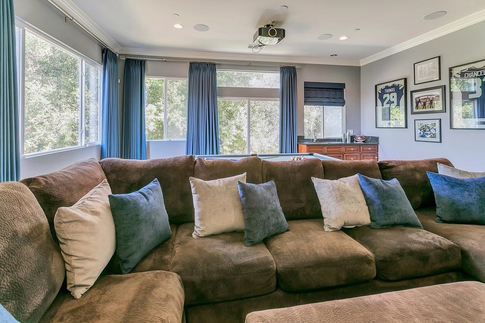 Example of a large transitional enclosed ceramic tile home theater design in Los Angeles with gray walls and a projector screen
