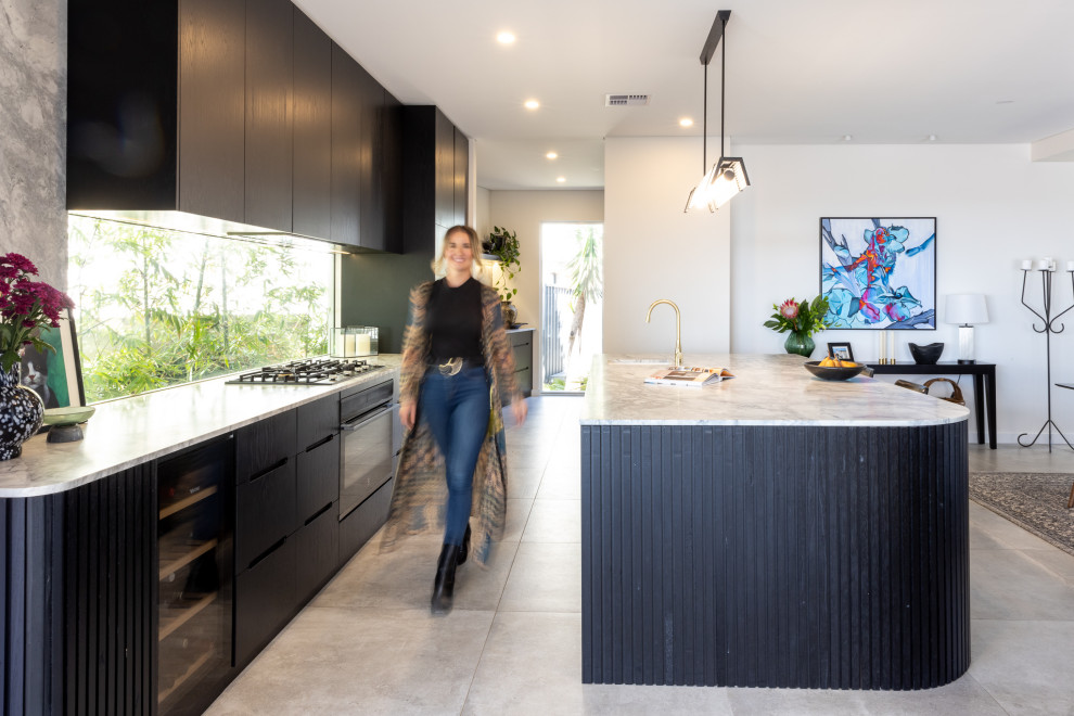 This is an example of a large contemporary galley kitchen/diner in Perth with a submerged sink, marble worktops, multi-coloured splashback, marble splashback, coloured appliances, porcelain flooring, an island, grey floors, multicoloured worktops and black cabinets.