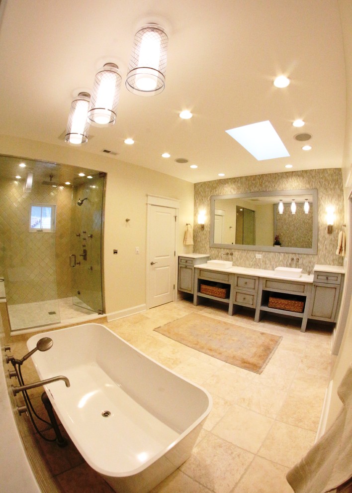 Inspiration for a large transitional master bathroom in Chicago with a vessel sink, recessed-panel cabinets, green cabinets, marble benchtops, a freestanding tub, an alcove shower, a one-piece toilet, green tile, ceramic tile, beige walls and vinyl floors.
