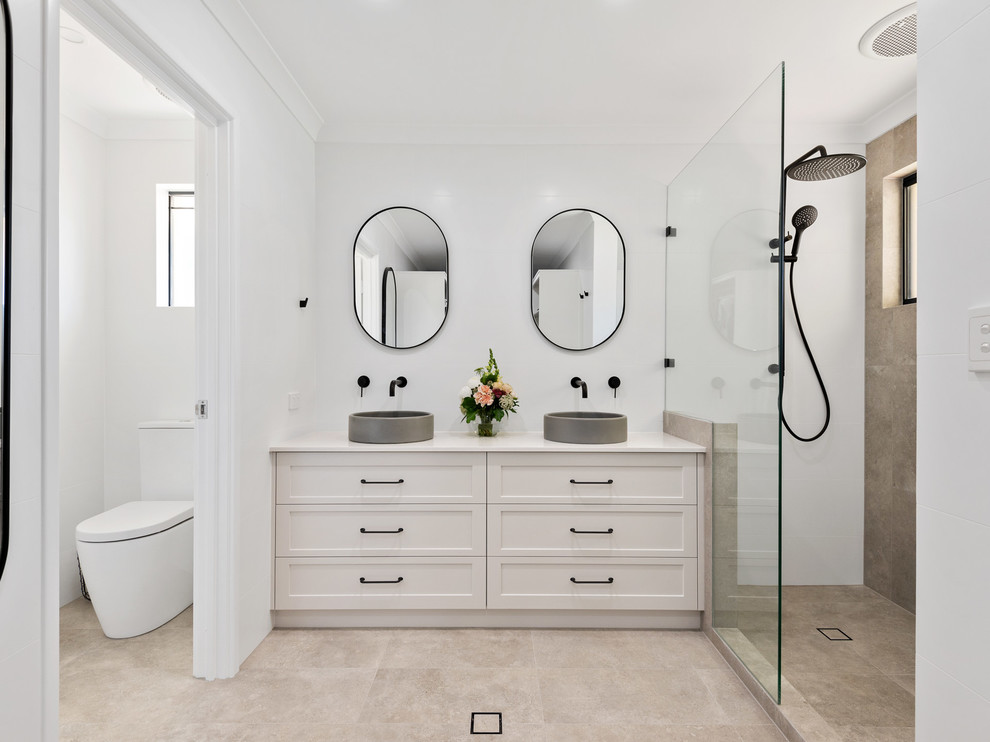 Transitional master bathroom in Perth with shaker cabinets, white cabinets, an alcove shower, a two-piece toilet, beige tile, white walls, a vessel sink, beige floor, an open shower and white benchtops.