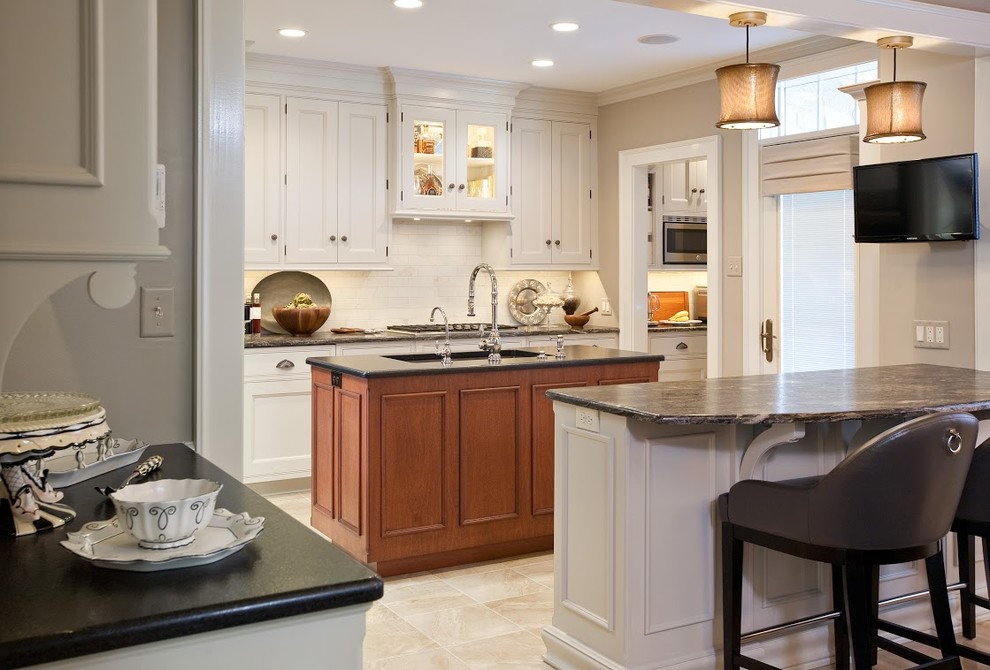 Inspiration for a mid-sized transitional light wood floor kitchen remodel with flat-panel cabinets, white cabinets, white backsplash, stainless steel appliances and an island
