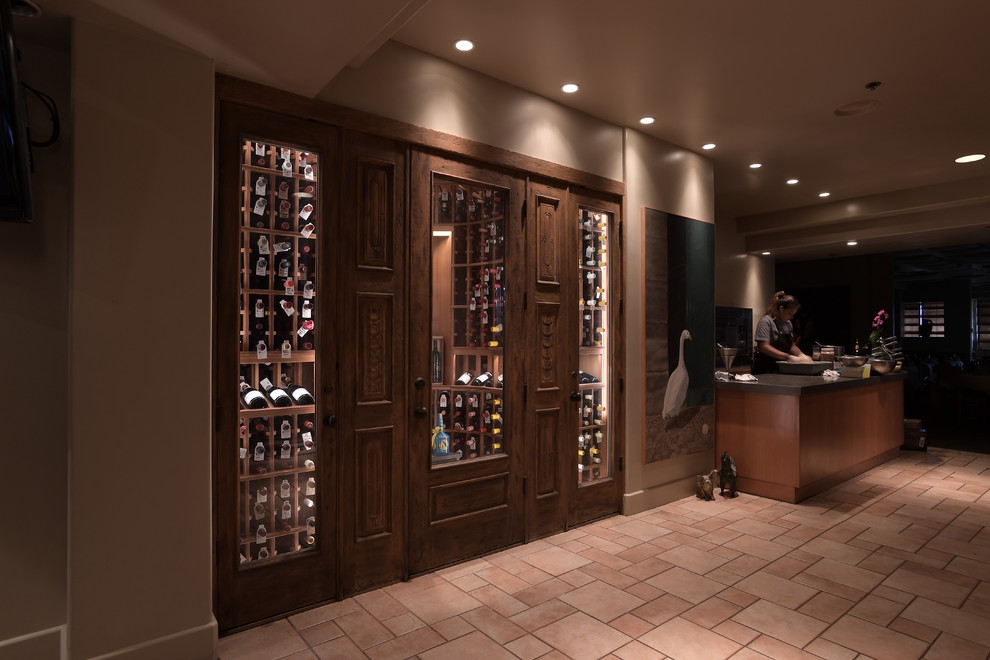 Mid-sized farmhouse porcelain tile wine cellar photo in San Diego