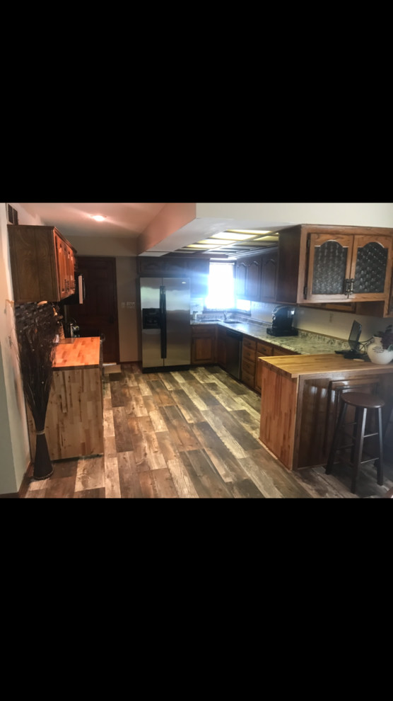 Example of a mountain style kitchen design in Denver