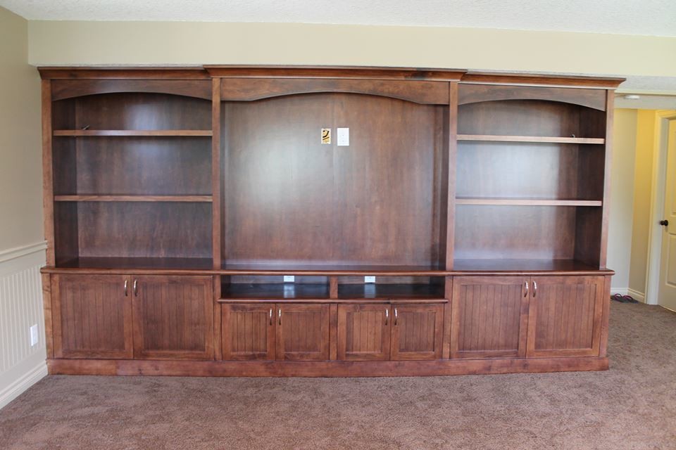 Example of a mid-sized transitional underground carpeted basement design in Calgary with gray walls