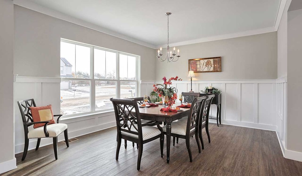 Photo of a large traditional separate dining room in Other with grey walls, laminate floors and no fireplace.