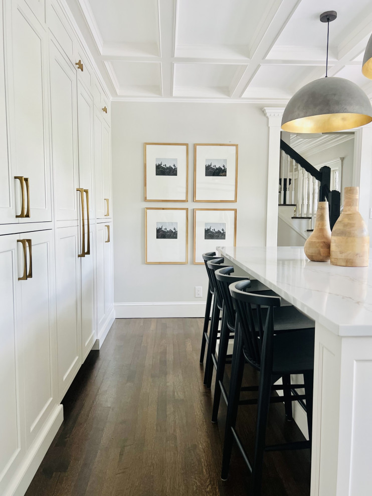 White kitchen with hidden pantry and fridge