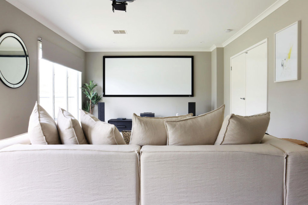 Design ideas for a mid-sized beach style enclosed home theatre in Other with white walls, carpet and a projector screen.